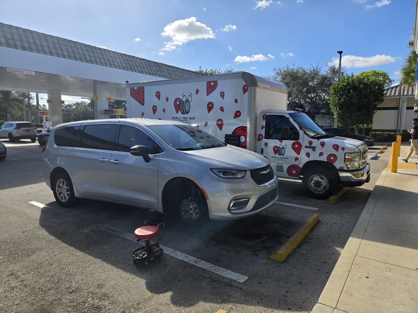 Mobile tire service in parking lot at gas station